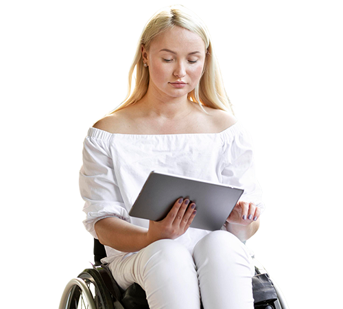 Woman sitting in a wheelchair using using a tablet